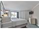Spacious bedroom with two beds and balcony access at 2805 N Ocean Blvd. # 301, Myrtle Beach, SC 29577