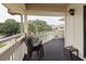 Private balcony with seating for three and a view of trees at 2805 N Ocean Blvd. # 301, Myrtle Beach, SC 29577