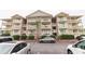 Three-story building with brick and light-colored siding, featuring balconies at 2805 N Ocean Blvd. # 301, Myrtle Beach, SC 29577