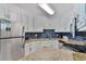Updated kitchen features granite countertops and white cabinets at 2805 N Ocean Blvd. # 301, Myrtle Beach, SC 29577