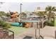 Resort-style pool with a waterslide and surrounding lounge chairs at 2805 N Ocean Blvd. # 301, Myrtle Beach, SC 29577