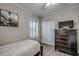 Cozy bedroom with a twin bed, dresser, and large closet at 5310 N Ocean Blvd. # 301, Myrtle Beach, SC 29577
