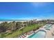 Aerial view of resort-style pool with surrounding lawn and beach access at 5310 N Ocean Blvd. # 301, Myrtle Beach, SC 29577
