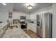 Modern kitchen with granite countertops and stainless steel appliances at 5310 N Ocean Blvd. # 301, Myrtle Beach, SC 29577