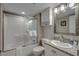 Bathroom with granite vanity, tub/shower combo and white cabinets at 5310 N Ocean Blvd. # 301, Myrtle Beach, SC 29577