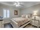 Bedroom with a queen bed and plantation shutters at 5310 N Ocean Blvd. # 301, Myrtle Beach, SC 29577