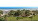 Oceanfront property with palm trees and grassy area at 5310 N Ocean Blvd. # 301, Myrtle Beach, SC 29577