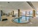 Indoor pool and hot tubs with large windows at 5310 N Ocean Blvd. # 301, Myrtle Beach, SC 29577