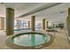 Indoor pool and hot tubs with large windows at 5310 N Ocean Blvd. # 301, Myrtle Beach, SC 29577