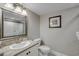 Bathroom with granite vanity and a framed picture at 5310 N Ocean Blvd. # 301, Myrtle Beach, SC 29577