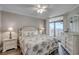 Bedroom with ocean view, comfortable bedding, and ample dresser space at 5310 N Ocean Blvd. # 301, Myrtle Beach, SC 29577