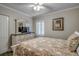Bedroom with a dresser, TV, and floral bedding at 5310 N Ocean Blvd. # 301, Myrtle Beach, SC 29577