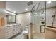 Bathroom with granite vanity, walk-in shower, and white cabinets at 5310 N Ocean Blvd. # 301, Myrtle Beach, SC 29577