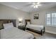 Bedroom with two twin beds and ceiling fan at 5310 N Ocean Blvd. # 301, Myrtle Beach, SC 29577