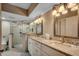 Bathroom with granite countertops, double vanity, and walk-in shower at 5310 N Ocean Blvd. # 301, Myrtle Beach, SC 29577