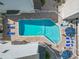 Community pool with lounge chairs and umbrellas at 209 75Th Ave. N # 10, Myrtle Beach, SC 29572