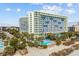 Aerial view of oceanfront hotel with pool and beach access at 1105 S Ocean Blvd. # 228, Myrtle Beach, SC 29577
