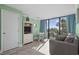 Living room with TV, small table, and ocean view at 1105 S Ocean Blvd. # 228, Myrtle Beach, SC 29577