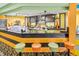 Ice cream shop with stools and menu featuring various ice cream flavors and sundaes at 1105 S Ocean Blvd. # 228, Myrtle Beach, SC 29577