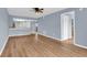 Bright living room, features wood-look floors and ceiling fan at 1301 Pridgen Rd. # 105, Myrtle Beach, SC 29577
