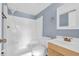 Bathroom with shower stall, toilet and vanity with wood cabinet at 1301 Pridgen Rd. # 105, Myrtle Beach, SC 29577