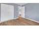 Bright bedroom with double door closet and wood-look floors at 1301 Pridgen Rd. # 105, Myrtle Beach, SC 29577