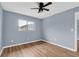 Bedroom with wood-look floors and a window with natural light at 1301 Pridgen Rd. # 105, Myrtle Beach, SC 29577