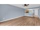 Open living room with wood-look floors and kitchen view at 1301 Pridgen Rd. # 105, Myrtle Beach, SC 29577