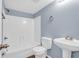 Clean bathroom with shower/tub combo and pedestal sink at 1301 Pridgen Rd. # 105, Myrtle Beach, SC 29577