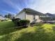 View of the house's side exterior, showcasing a deck and landscaping at 709 Ashley Manor Dr., Longs, SC 29568