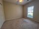 Bright bedroom featuring carpeted floor and large window at 709 Ashley Manor Dr., Longs, SC 29568