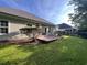 Backyard view of the house, highlighting a deck and surrounding greenery at 709 Ashley Manor Dr., Longs, SC 29568