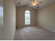 Well-lit bedroom with carpet flooring and a ceiling fan at 709 Ashley Manor Dr., Longs, SC 29568