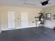 Garage interior with ample storage space, a utility sink, and extra doors at 709 Ashley Manor Dr., Longs, SC 29568