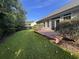 Another view of the house's exterior with a deck and landscaping at 709 Ashley Manor Dr., Longs, SC 29568