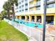 Resort-style pool with surrounding lounge chairs and lush landscaping at 2000 N Ocean Blvd. # 503, Myrtle Beach, SC 29577