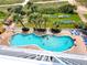 Aerial view of resort pool area with multiple people enjoying the water and lounge chairs at 2000 N Ocean Blvd. # 503, Myrtle Beach, SC 29577