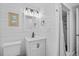Clean bathroom with white vanity, shower, and updated fixtures at 1919 South Waccamaw Dr., Garden City Beach, SC 29576