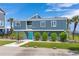 Two-story home with teal door and ocean view at 1919 South Waccamaw Dr., Garden City Beach, SC 29576