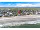 Aerial view of beachfront home and neighborhood at 1919 South Waccamaw Dr., Garden City Beach, SC 29576