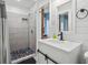 Bathroom with a walk-in shower and white vanity at 1919 South Waccamaw Dr., Garden City Beach, SC 29576
