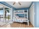 Bedroom with a bunk bed and ocean view at 1919 South Waccamaw Dr., Garden City Beach, SC 29576
