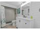 Bright bathroom with white vanity, shower, and coastal decor at 1919 South Waccamaw Dr., Garden City Beach, SC 29576