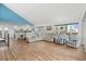 Bright living room featuring vaulted ceilings and light hardwood floors at 1919 South Waccamaw Dr., Garden City Beach, SC 29576