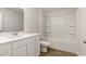 Clean bathroom with white vanity, tub, and shower at 379 Jeff Waters Circle, Longs, SC 29568