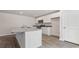 White kitchen with granite island and stainless steel appliances at 379 Jeff Waters Circle, Longs, SC 29568