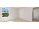 Spacious bedroom with carpet, large window and door to hallway at 170 Calm Dr., Little River, SC 29566