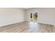 Spacious living room with sliding glass doors leading to a backyard at 170 Calm Dr., Little River, SC 29566