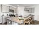 Spacious kitchen with granite countertops and gray cabinets at 189 Hadley Springs Ave, Longs, SC 29568