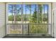 Screened balcony overlooking lush green space at 5750 Oyster Catcher Dr. # 723, North Myrtle Beach, SC 29582